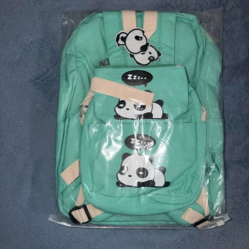 Green backpack with white panda graphics